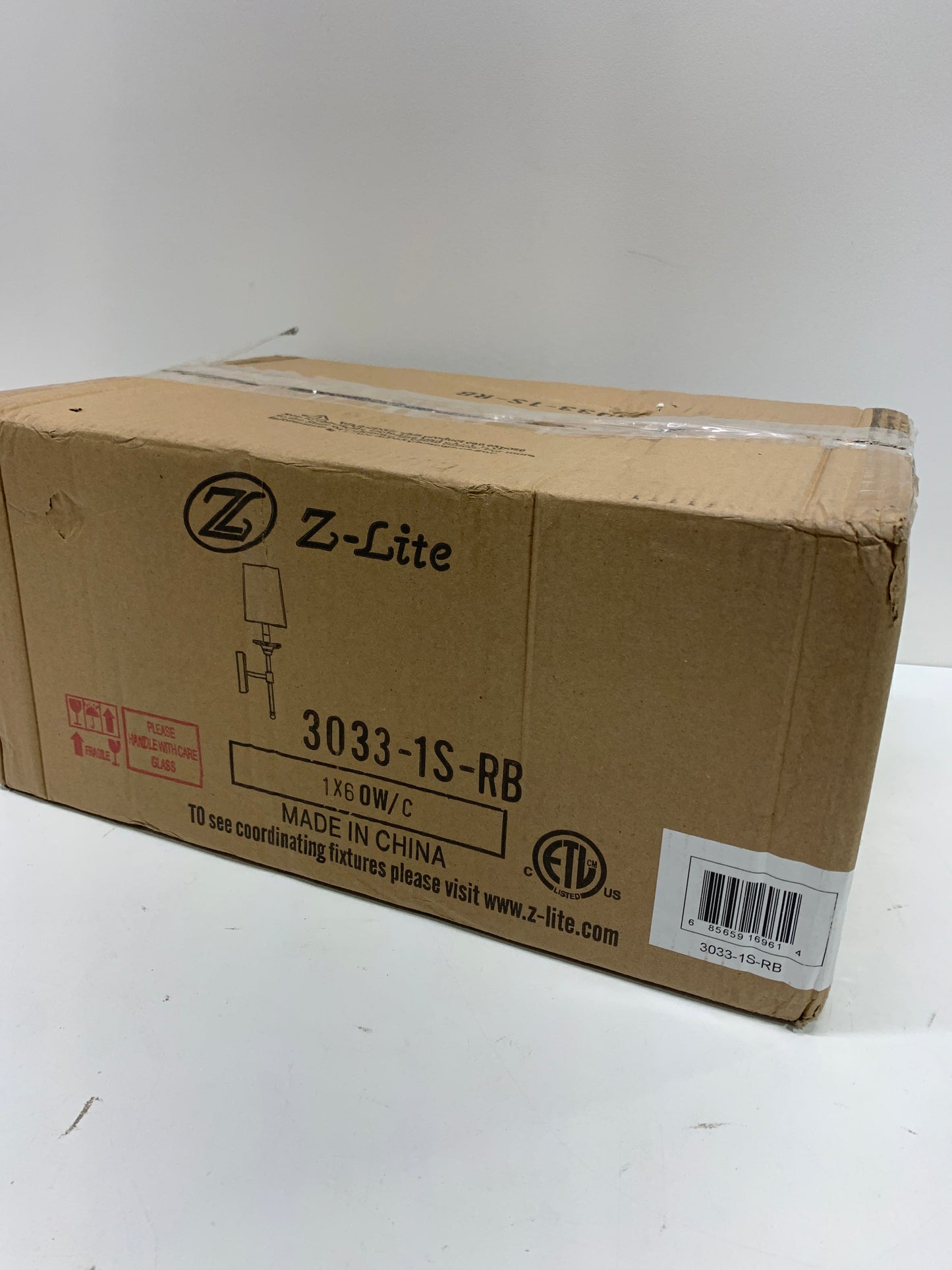 Emily 5.5 in. 1-Light Rubbed Brass Wall Sconce with Off White Cloth Cover Shade