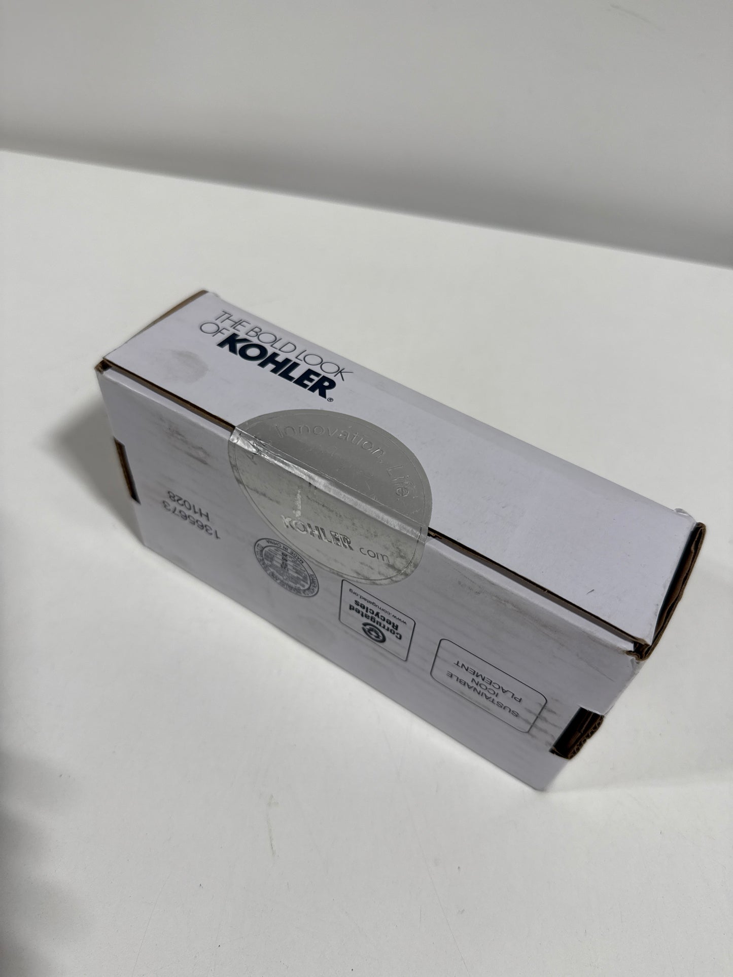 KOHLER Parallel Pivoting Toilet Paper Holder