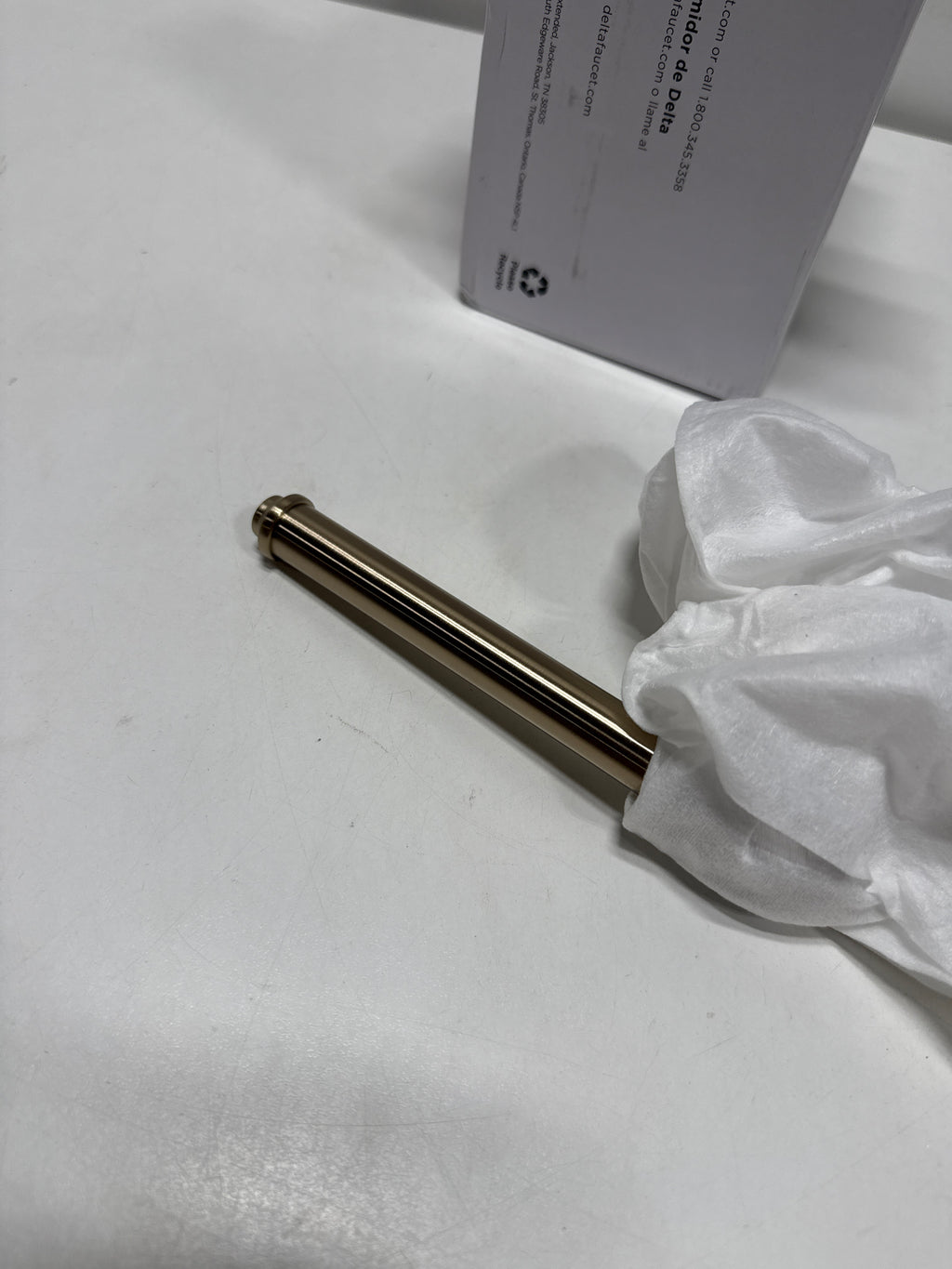 Delta 784500 Broderick Wall Mounted Pivoting Toilet Paper Holder Champagne Bronze
