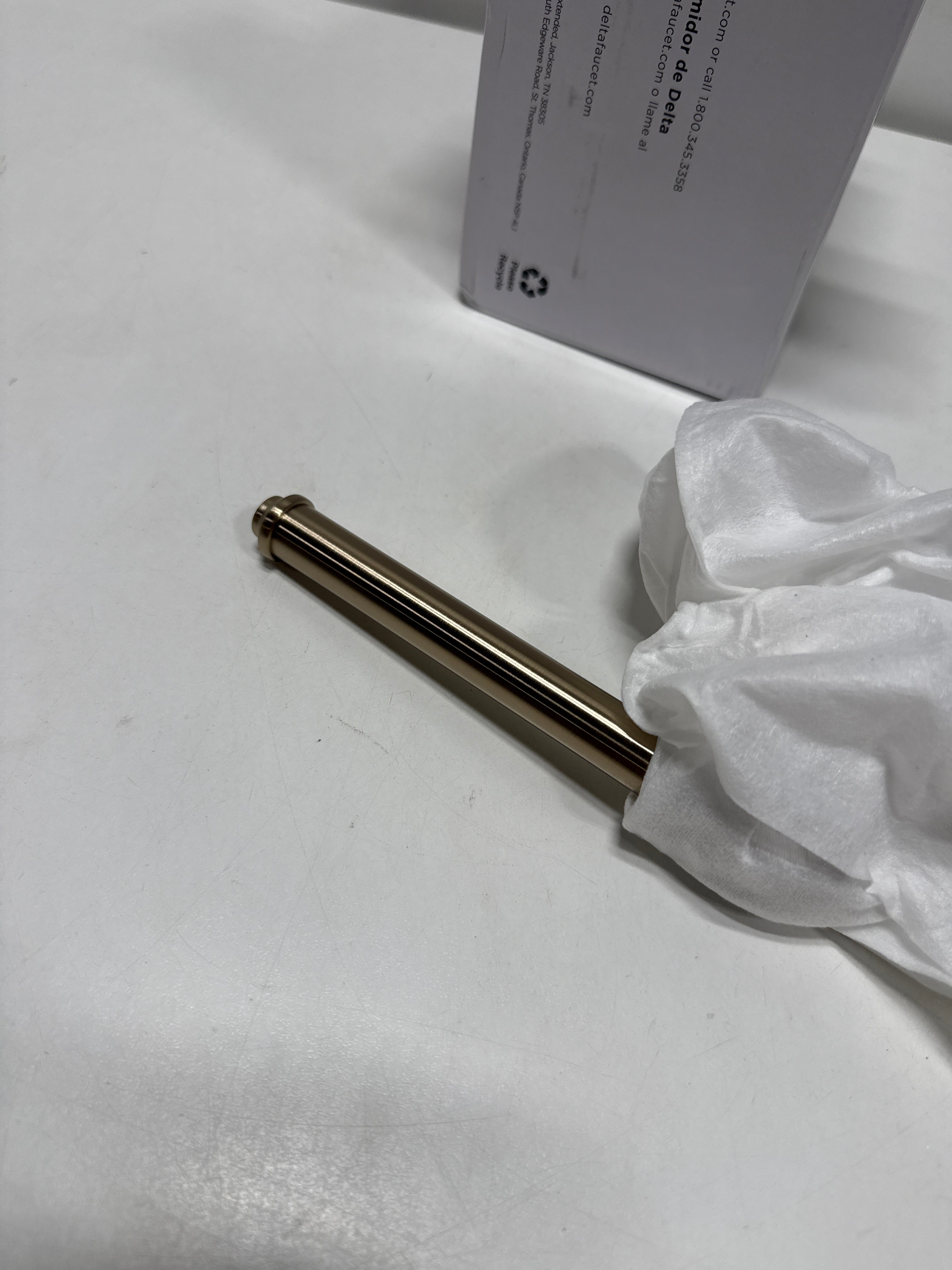 Delta 784500 Broderick Wall Mounted Pivoting Toilet Paper Holder Champagne Bronze