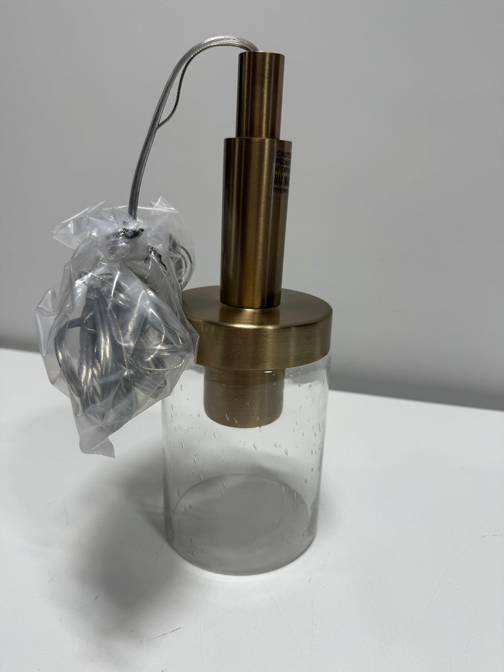 See Desc Champagne Bronze One Light Mini Pendant from the Madden Collection