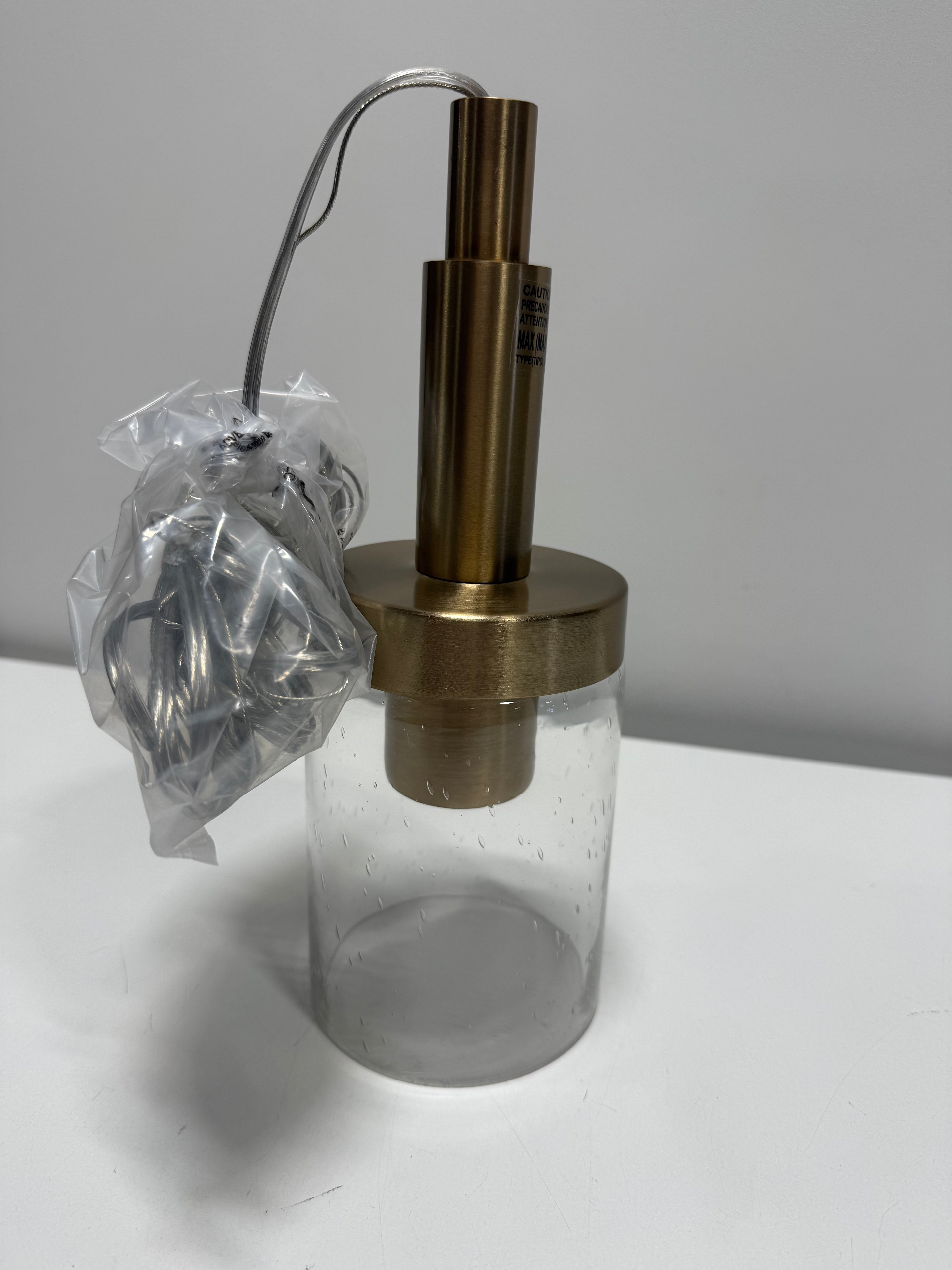 See Desc Champagne Bronze One Light Mini Pendant from the Madden Collection