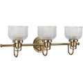 Archie Collection Three-Light Vintage Brass Clear Double Prismatic Glass Coastal Bath Vanity Light