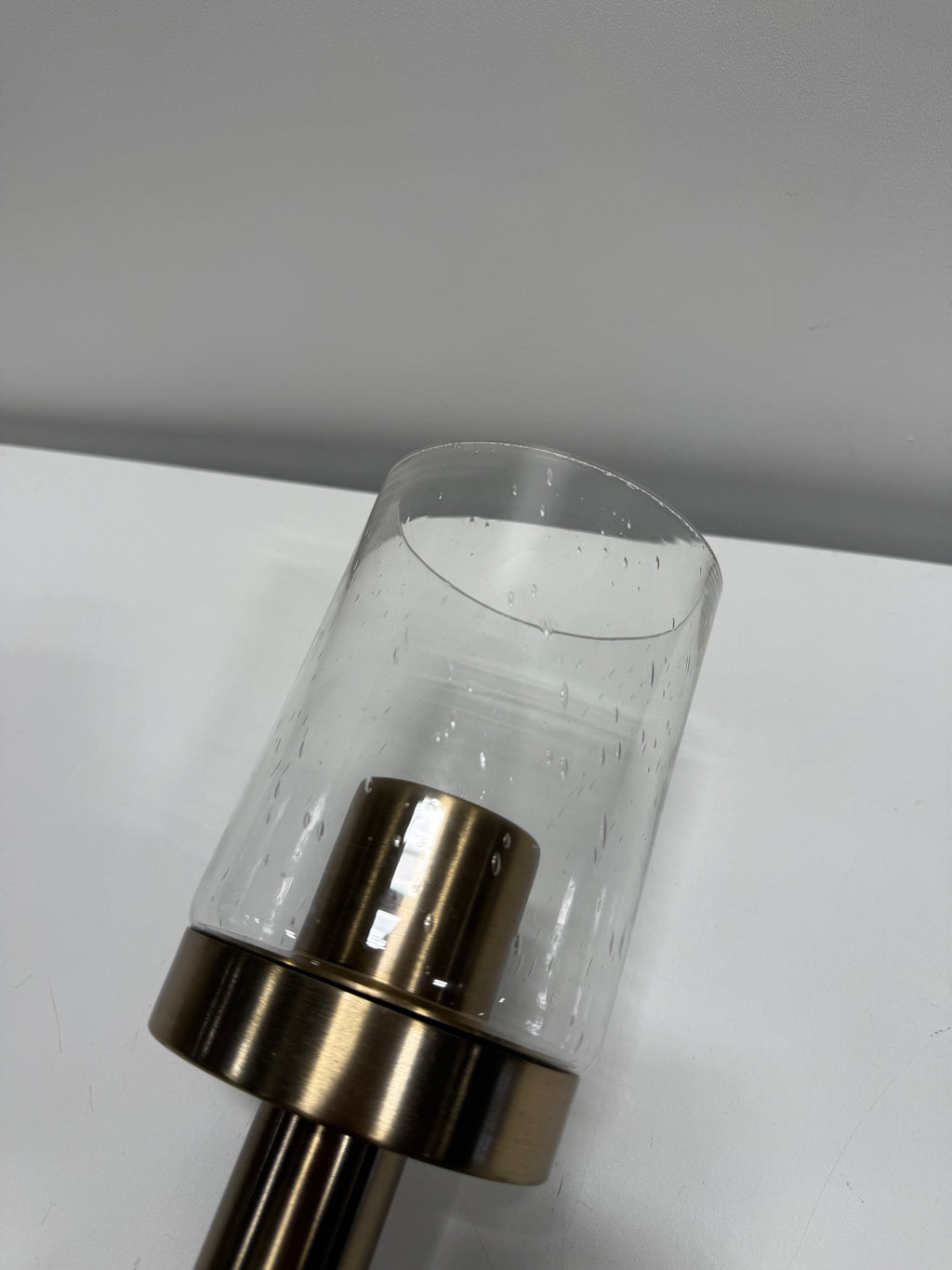 See Desc Champagne Bronze One Light Mini Pendant from the Madden Collection