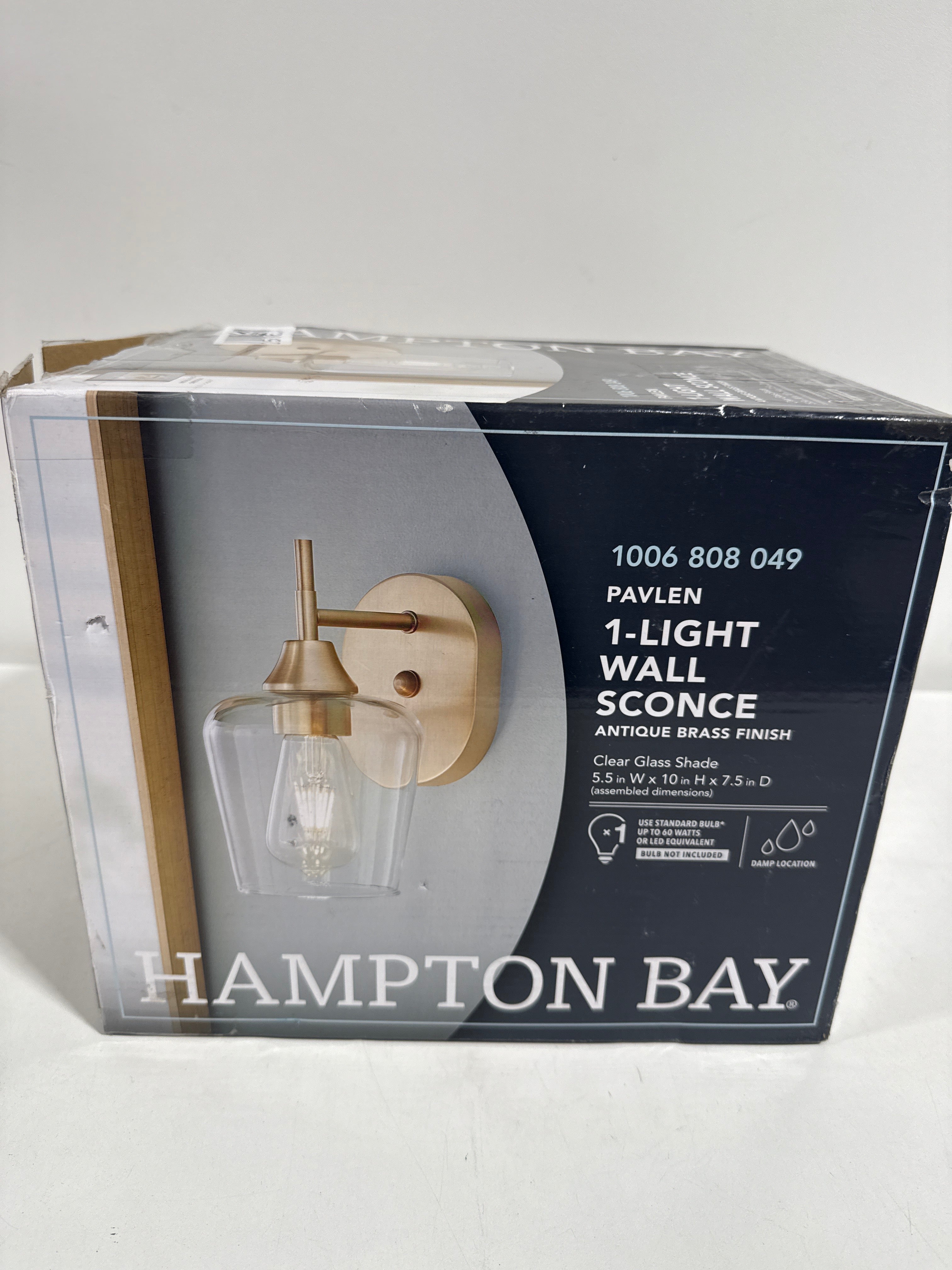 Pavlen 5.5 in. 1-Light Antique Brass Sconce with Clear Glass Shade - *Lighting & Electrical