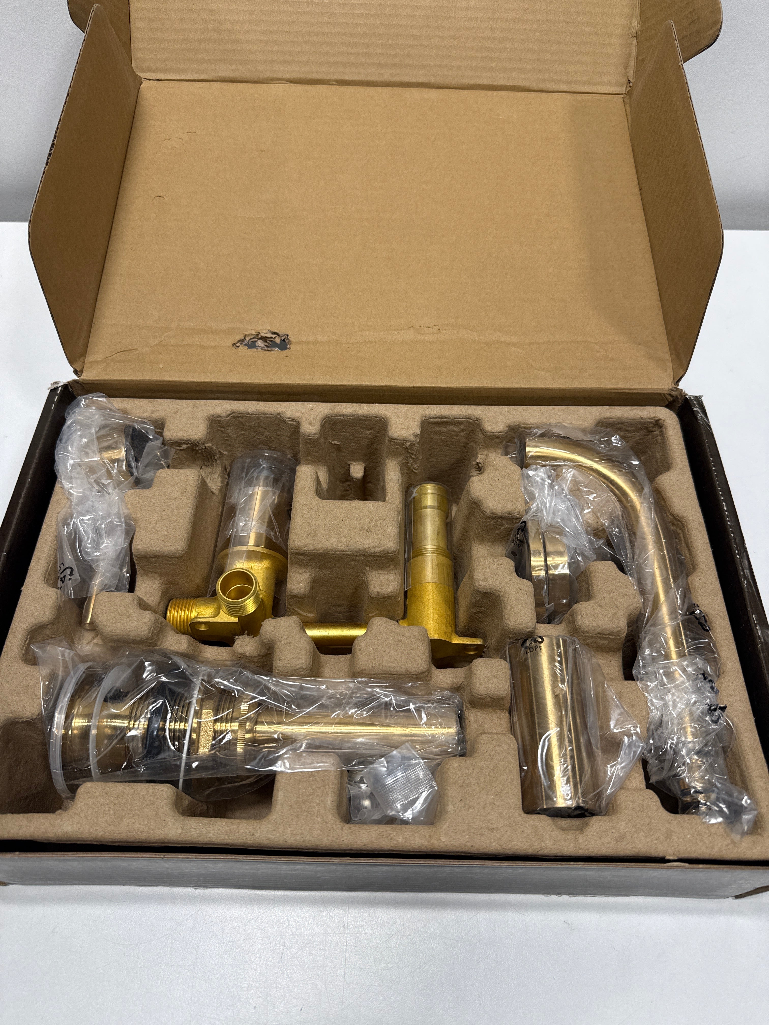 Lexia Single Handle Wall Mounted Bathroom Faucet in Brushed Gold