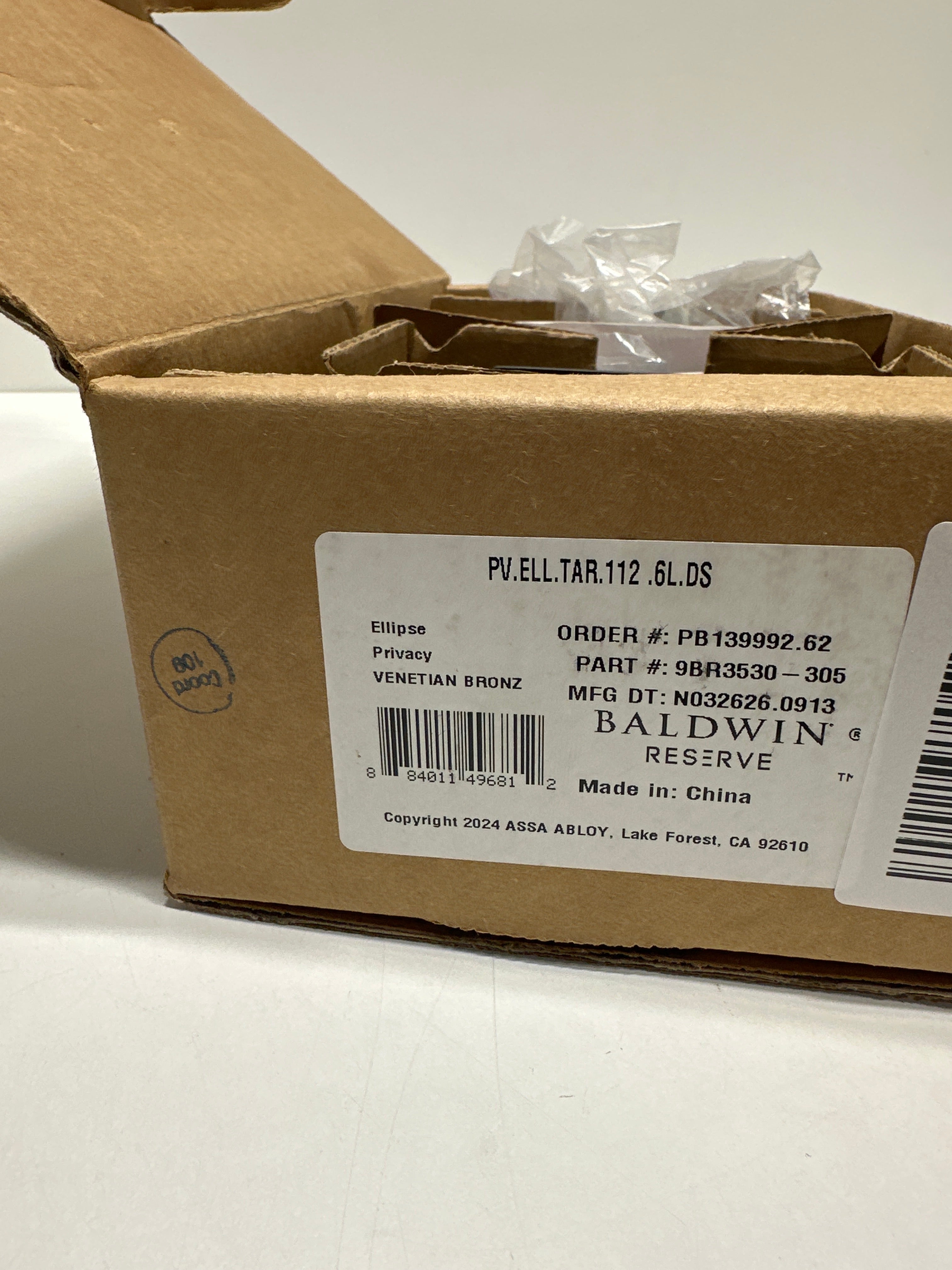 Baldwin PVELLTAR112 Reserve Privacy Ellipse with Traditional Arch Rose in Aged Bronze Finish