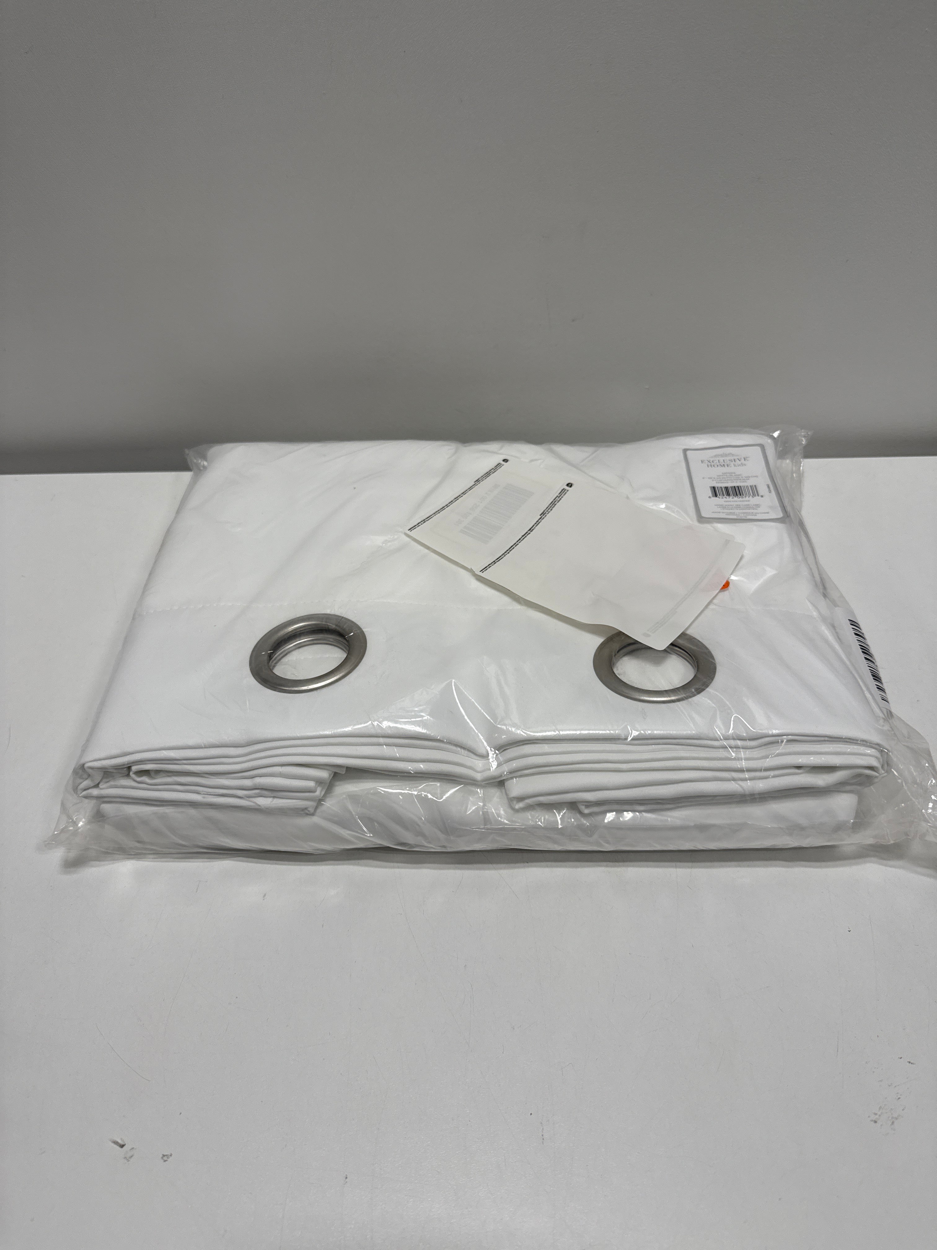 Exclusive Home Sateen Kids Twill Woven Room Darkening Blackout Grommet Top Curtain Panel Pair 52 X63 Winter White
